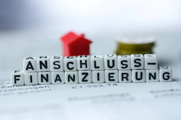 Německé slovo postupujte nahoru financování tvořené Abeceda bloky: Anschlussfinanzierung — Stock fotografie