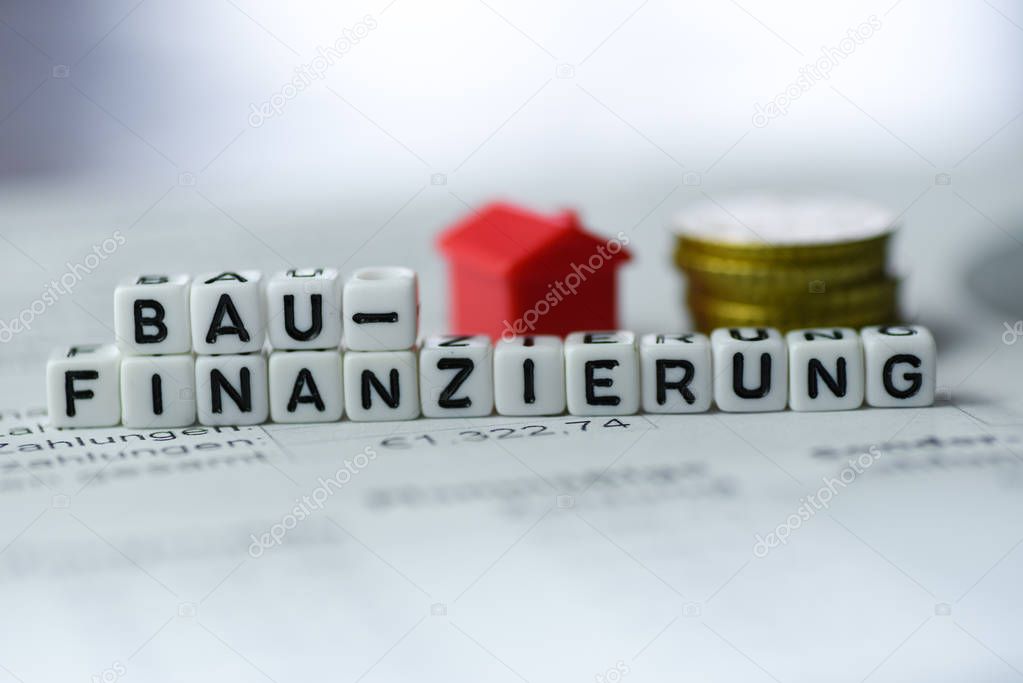 German Word Construction Financing formed by alphabet blocks: BAUFINANZIERUNG