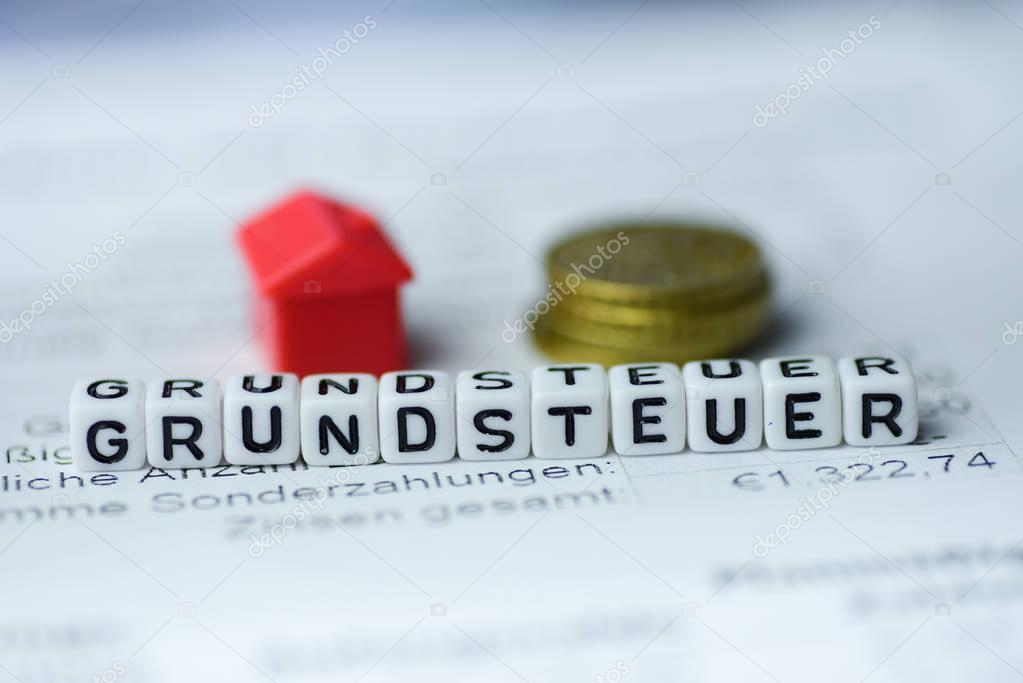 German Word LAND TAX formed by alphabet blocks: GRUNDSTEUER