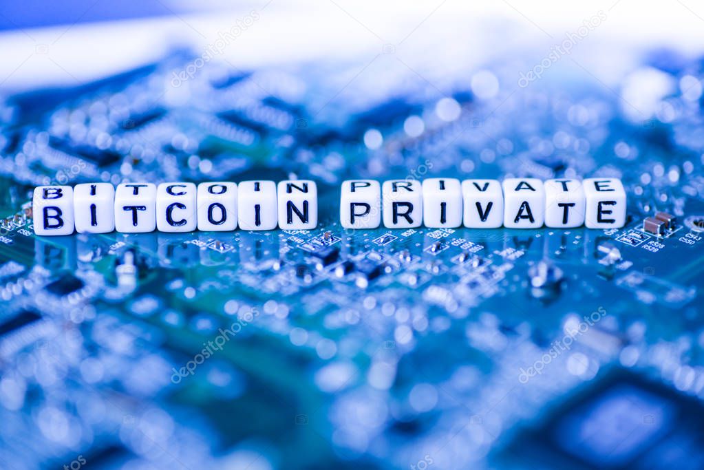 Word BITCOIN PRIVATE formed by alphabet blocks on mother cryptocurrency