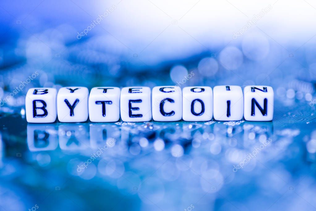 Word BYTECOIN formed by alphabet blocks on mother cryptocurrency