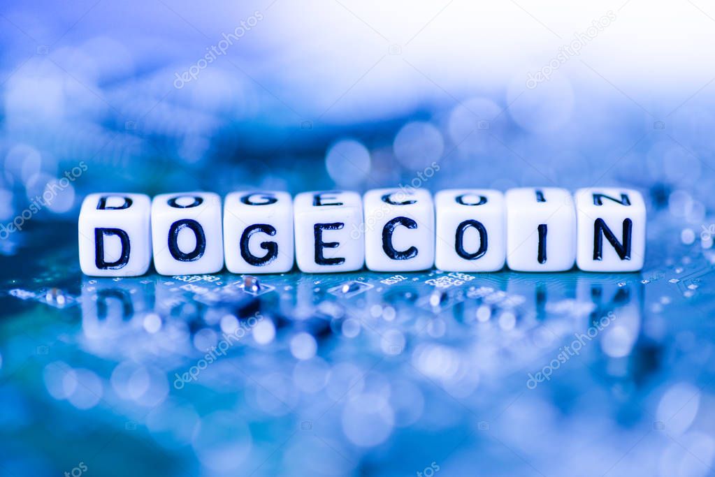 Word DOGECOIN formed by alphabet blocks on mother cryptocurrency