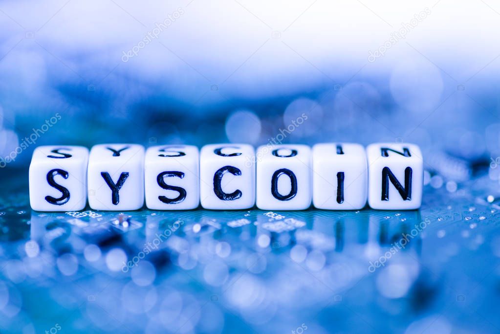 Word SYSCOIN formed by alphabet blocks on mother cryptocurrency