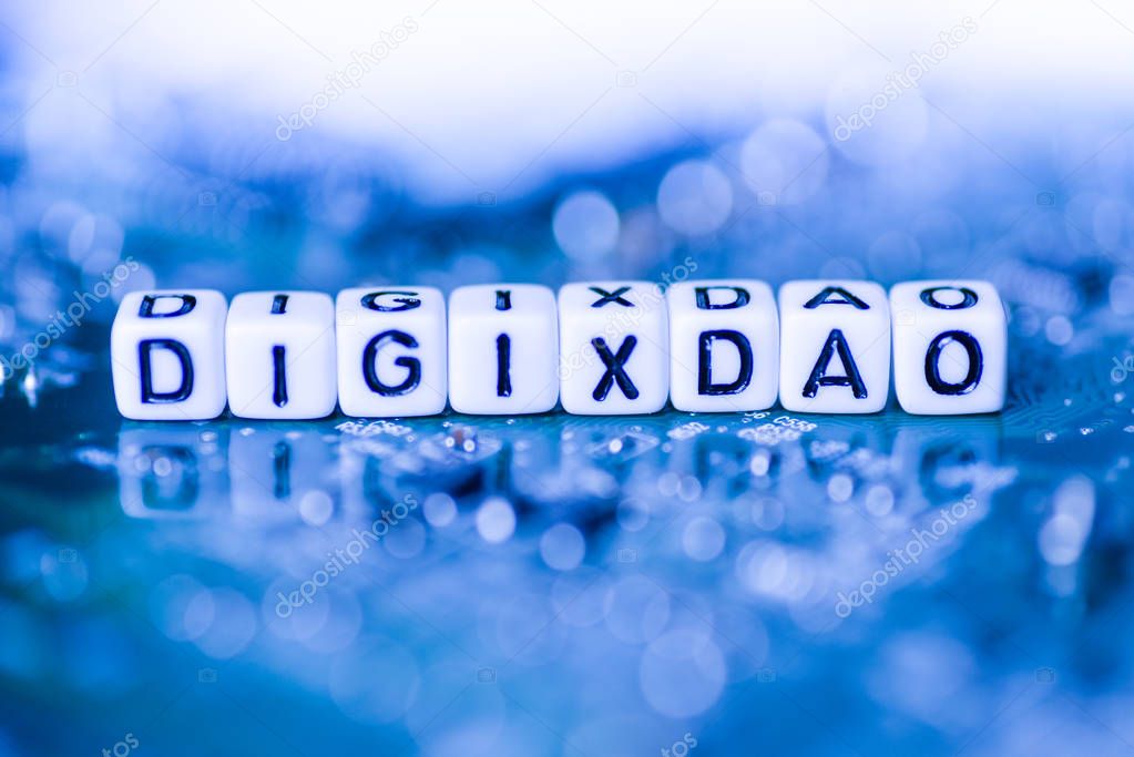 Word DIGIXDAO formed by alphabet blocks on mother cryptocurrency