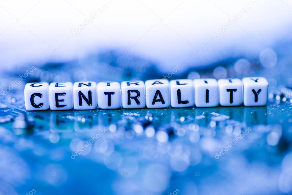 Word CENTRALITY formed by alphabet blocks on mother cryptocurrency