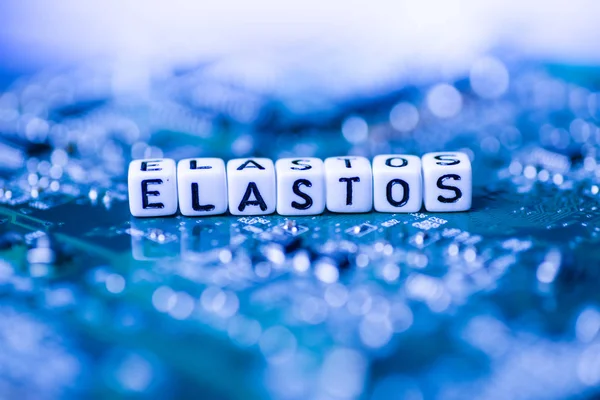 Word ELASTOS formed by alphabet blocks on mother cryptocurrency — Stock Photo, Image