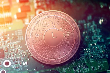 shiny copper CHRONO LOGIC cryptocurrency coin on blurry motherboard background clipart