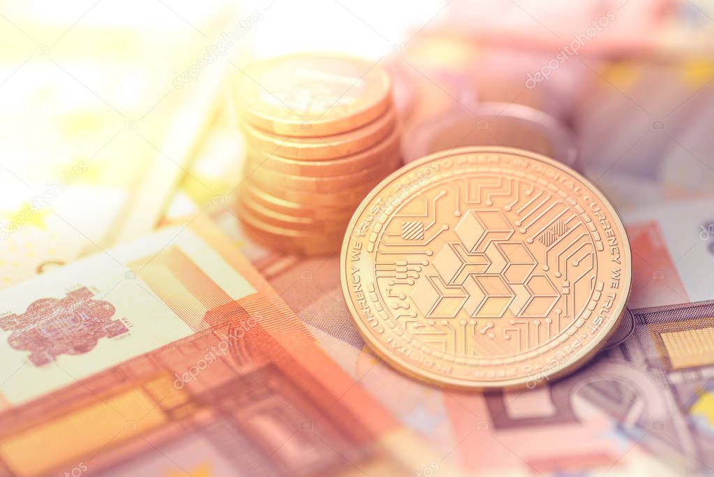 shiny golden ATLANT cryptocurrency coin on blurry background with euro money