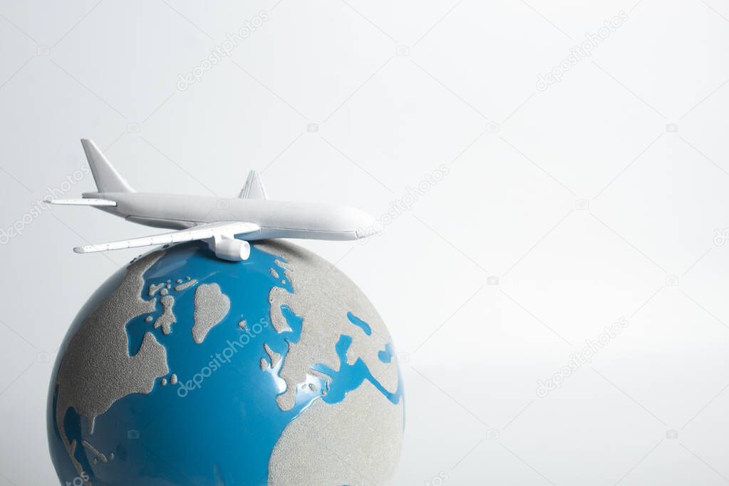 airplane on globe in travel business transportation concept, tourist on flight fly