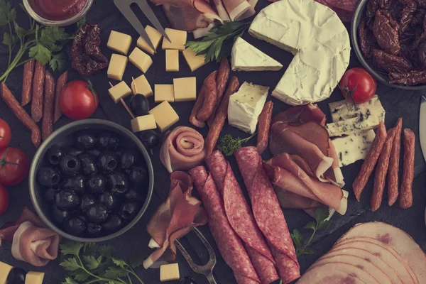 Cheese and meat appetizer selection. — Stock Photo, Image