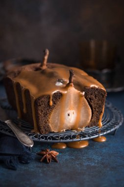 poached pear ginger cake with salted caramel sauce clipart