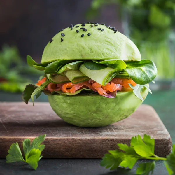 Healthy avocado burger with salmon — Stock Photo, Image