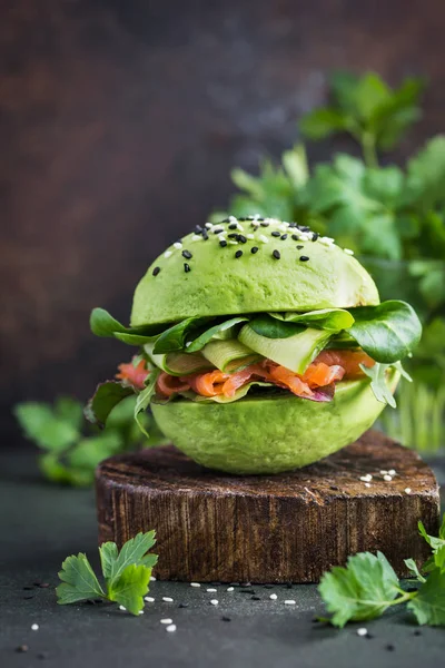 Healthy avocado burger with salmon — Stock Photo, Image