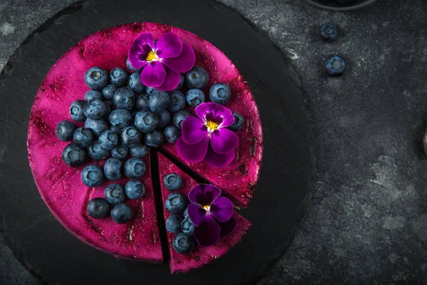 No baked blueberry mousse cake on dark background, selective foc — Stock Photo, Image