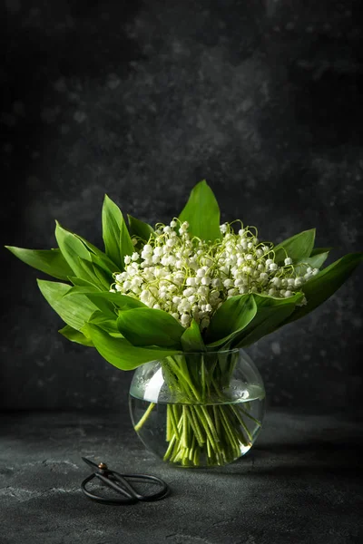 Lily of the valley flowers in glass vase — Stock Photo, Image
