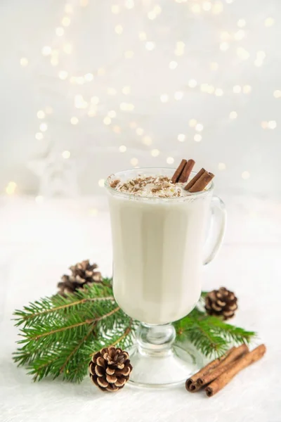Traditional winter eggnog cocktail with whipped cream and cinnam — Stock Photo, Image