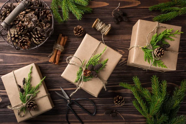 Christmas or New Year gifts wrapped in kraft paper — Stock Photo, Image