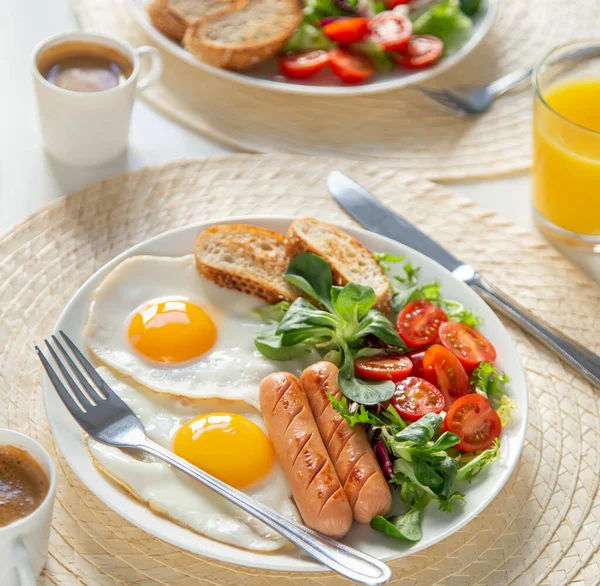 Breakfast Fried Eggs Sausages Fresh Vegetables Coffee Orange Juice White — Stock Photo, Image