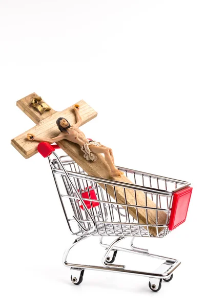 Crucifijo en carrito de la compra —  Fotos de Stock