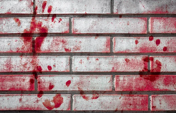 Bloody handprints and blotches of blood on grunge wall. — Stock Photo, Image