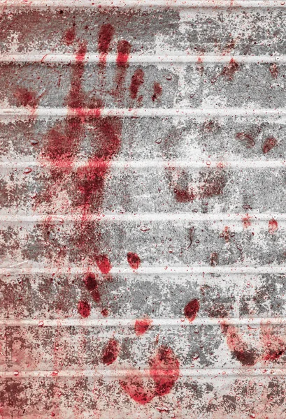 Bloody handprints and blotches of blood on grunge wall. — Stock Photo, Image