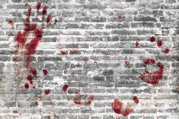 Huellas de manos sangrientas y manchas de sangre en la pared grunge . — Foto de Stock