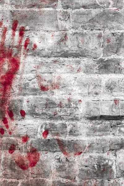 Bloody handprints and blotches of blood on grunge wall. — Stock Photo, Image