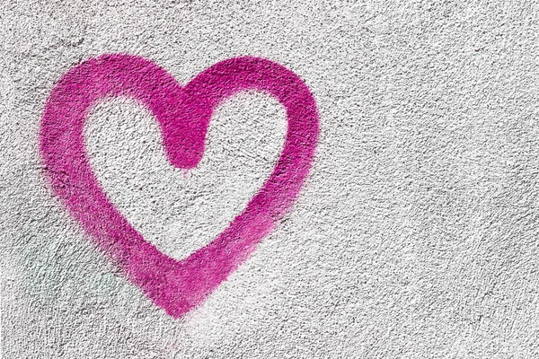 Pink heart on wall