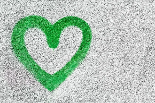 Green heart on wall