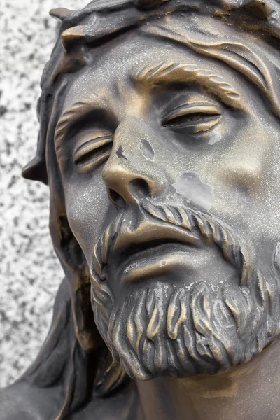 Bronze statue of the face of jesus