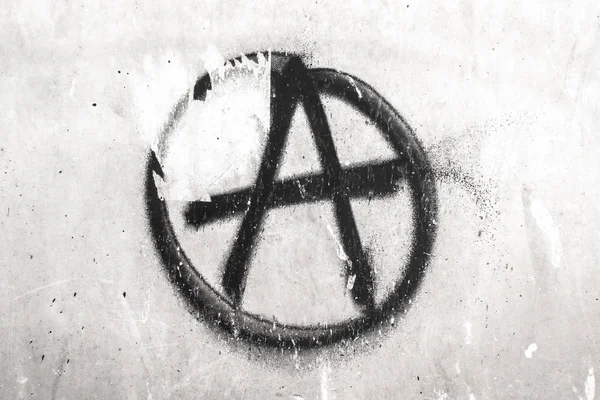 Symbole de l'Anarchie peint sur un mur Images De Stock Libres De Droits