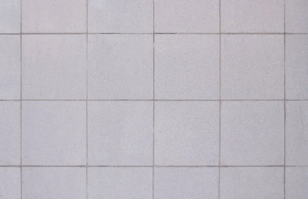 Mur avec carreaux carrés gris — Photo
