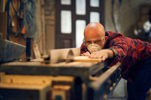 Carpenter at work at his workshop
