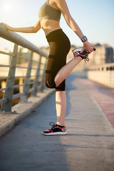 Woman stretching her leg — Stock Photo, Image