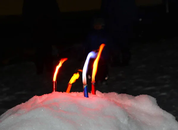 Small Multicolored Torches Standing Snow — Stock Photo, Image