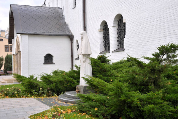 Moscow, Russia, October 13, 2019:Church of Saints Martha and Mary. Marfo-Mariinsky Convent, or Martha and Mary Convent of Mercy in Possession of Grand Duchess Elizabeth Feodorovna. Monument to Elizabeth Fedorovna sculptor Vyacheslav Klykov, 2010