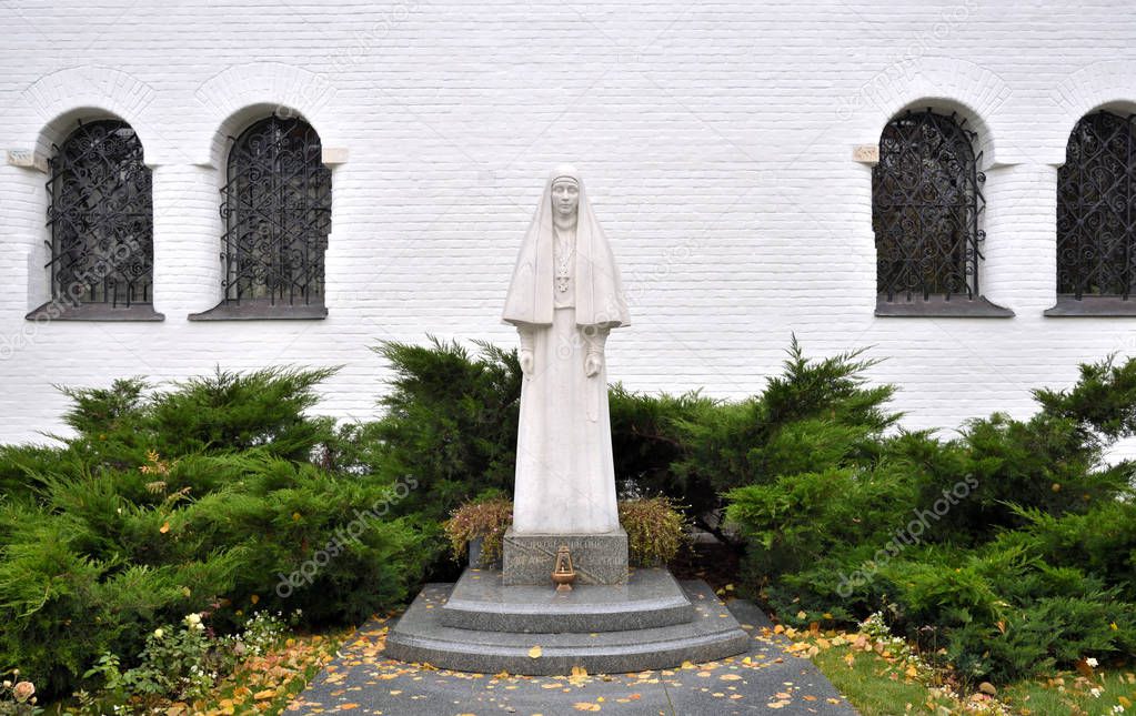 Moscow, Russia, October 13, 2019:Church of Saints Martha and Mary. Marfo-Mariinsky Convent, or Martha and Mary Convent of Mercy in Possession of Grand Duchess Elizabeth Feodorovna. Monument to Elizabeth Fedorovna sculptor Vyacheslav Klykov, 2010