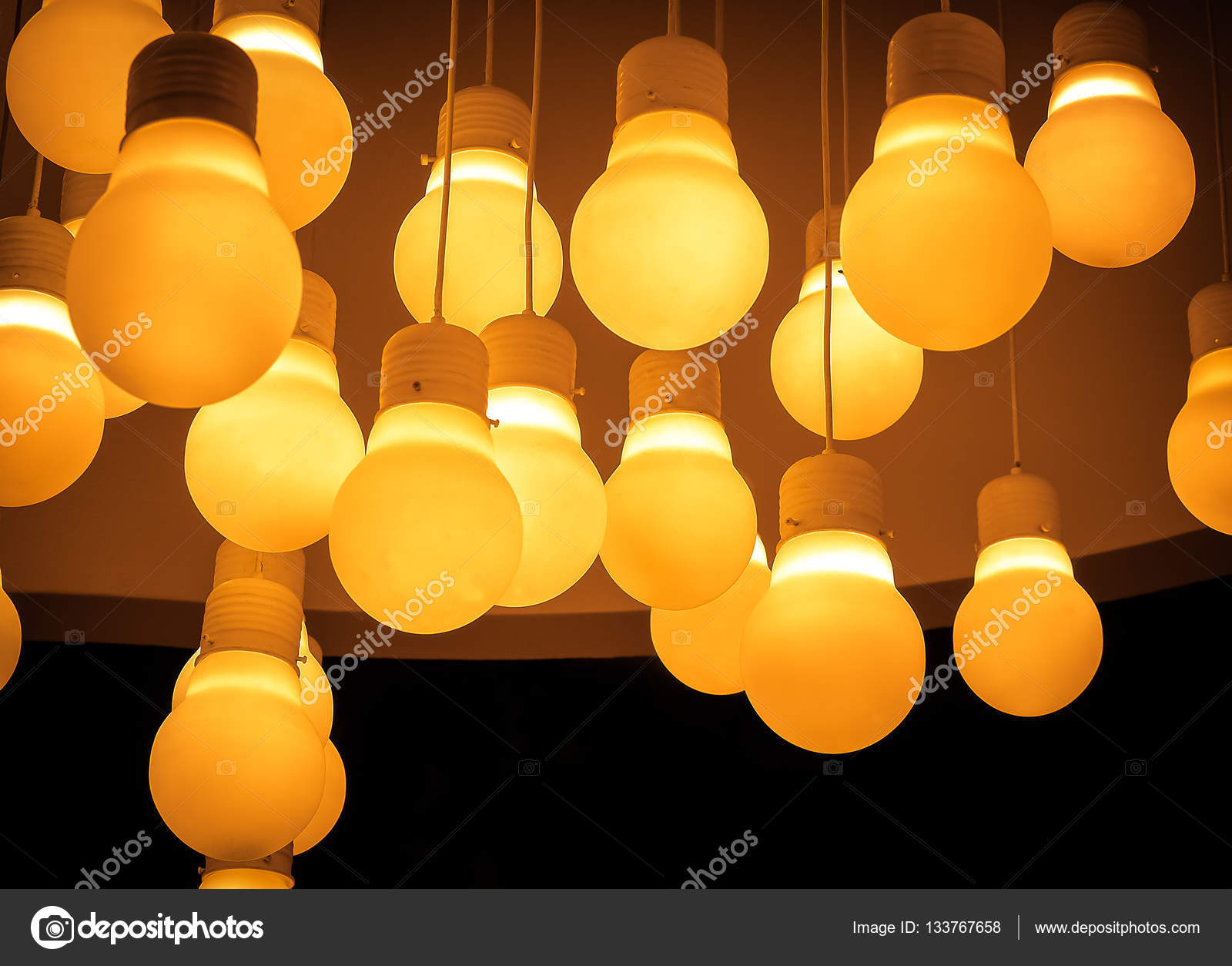 Orange Lighting Ball Hanging From The Ceiling Stock Photo