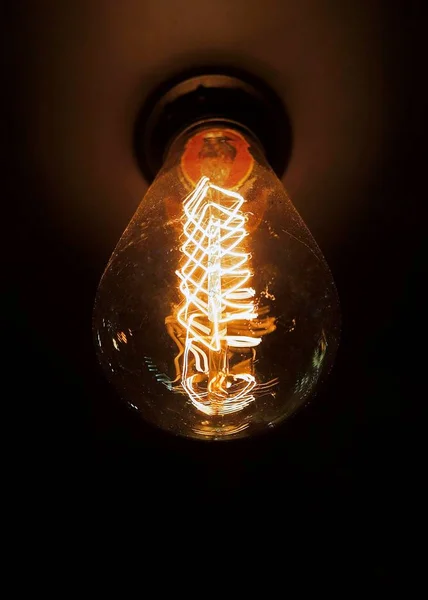 Vintage glowing light bulb — Stock Photo, Image