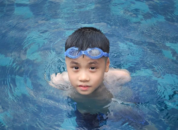 Asia boy kid child nine years old in swimming pool