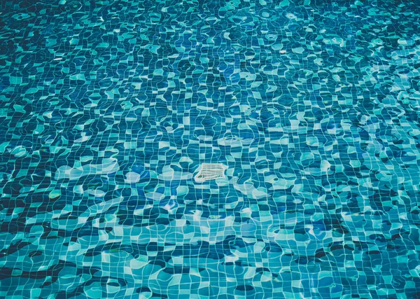 Background of rippled water in swimming pool, Top View.