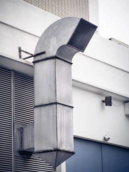 Smokestack for smoke out from kitchen. Chimney on wall