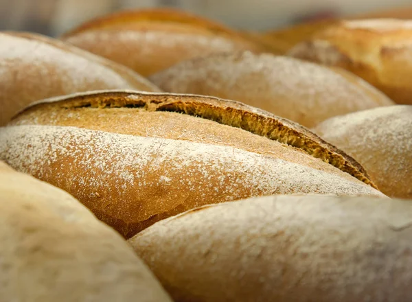 Loafs of French sourdough or French baguette, Freshly baked traditional french bread. Selective focus and close up.
