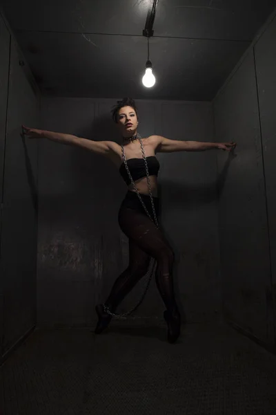 Sexy fetish ballerina in metal room. — Stock Photo, Image