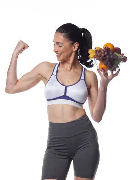Sexy Brunette Woman Fitness Suit Eating Fruits Studio Shoot Isolated — Stock Photo, Image