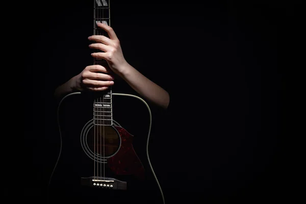 Woman Hugging Her Guitar, Isolated On Black — 스톡 사진