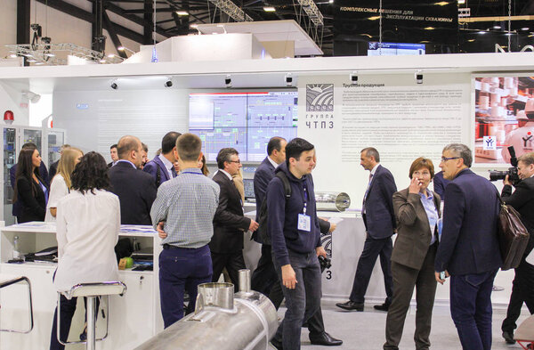 Visitors among the stands of companies.