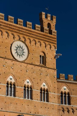 The Torre del Mangia is a tower in Siena, Italy clipart