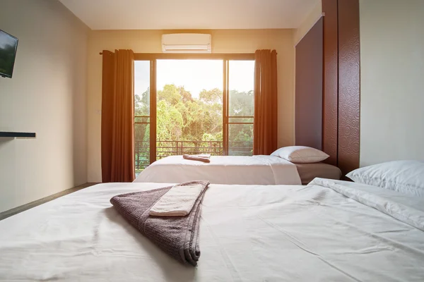 Pillows and white bed in bedroom — Stock Photo, Image