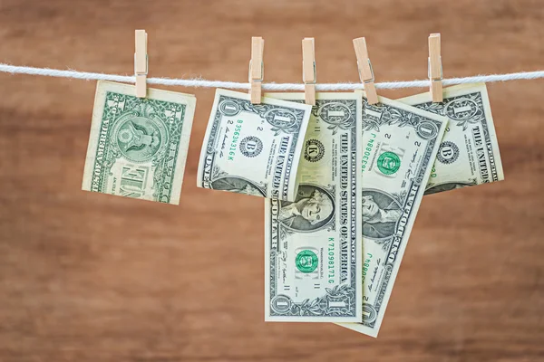 Dollar money hanging on clothespin — Stock Photo, Image